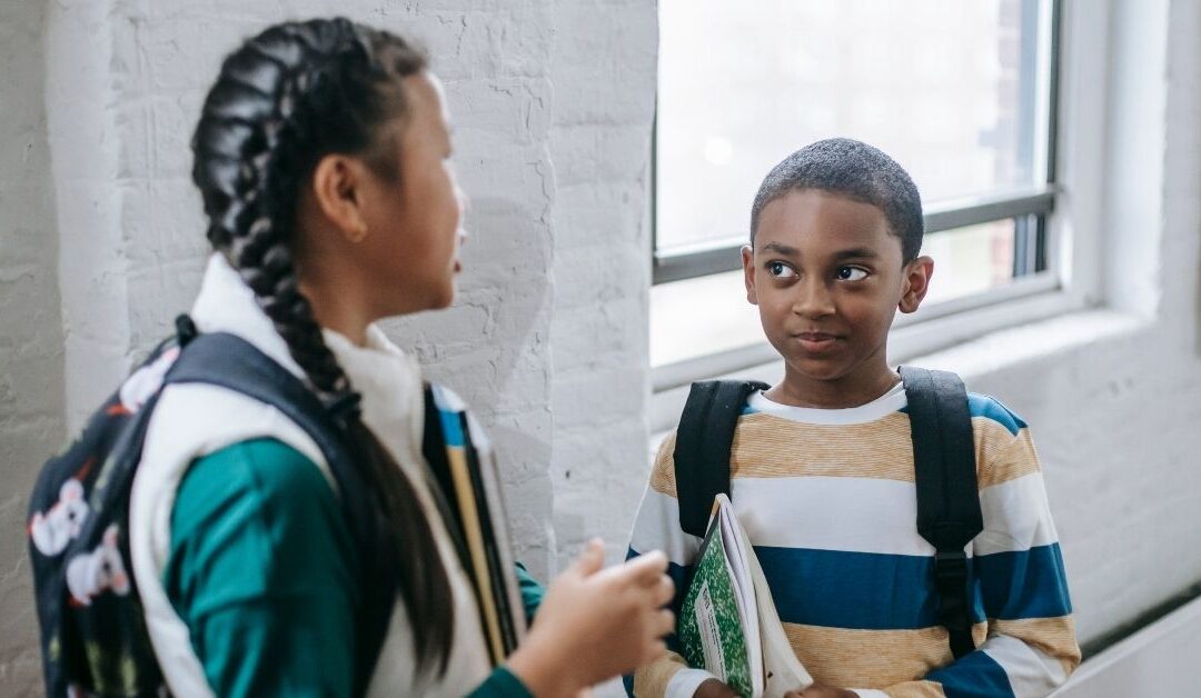 Boy and girl talking. How to teach your autistic child or teen perspective taking.