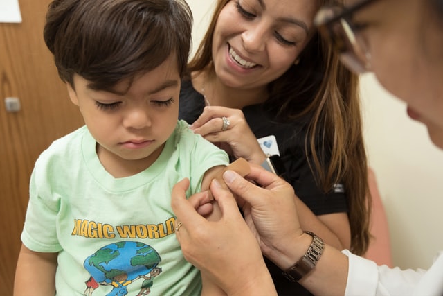 Doctor treating boy. Create a dream team for your child with autism.