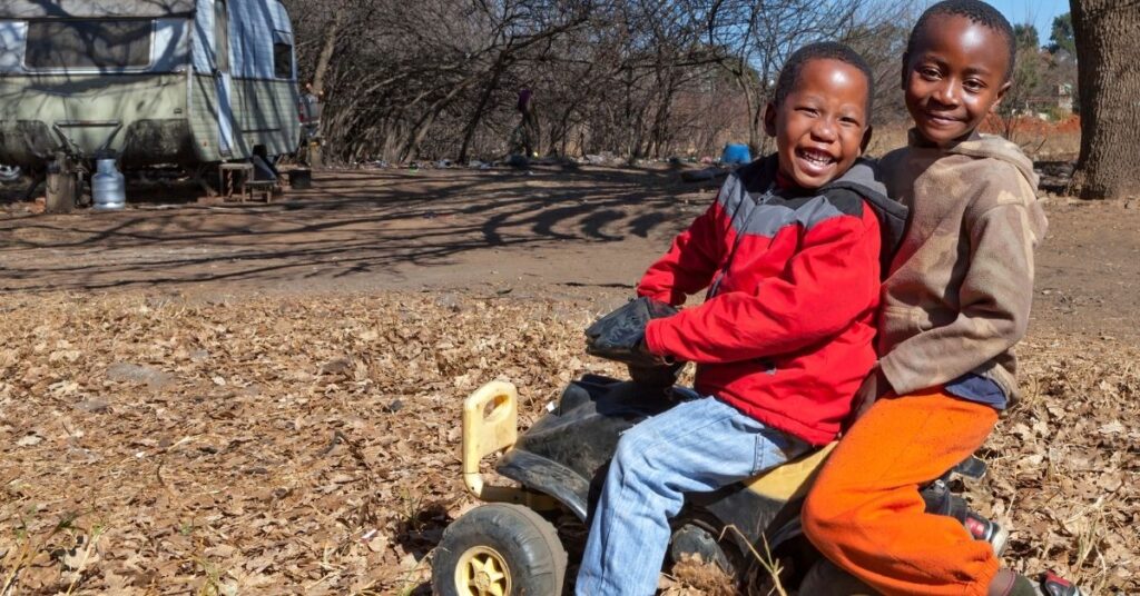 Two boys playing outside. How can you set up a successful playdate for your autistic child?