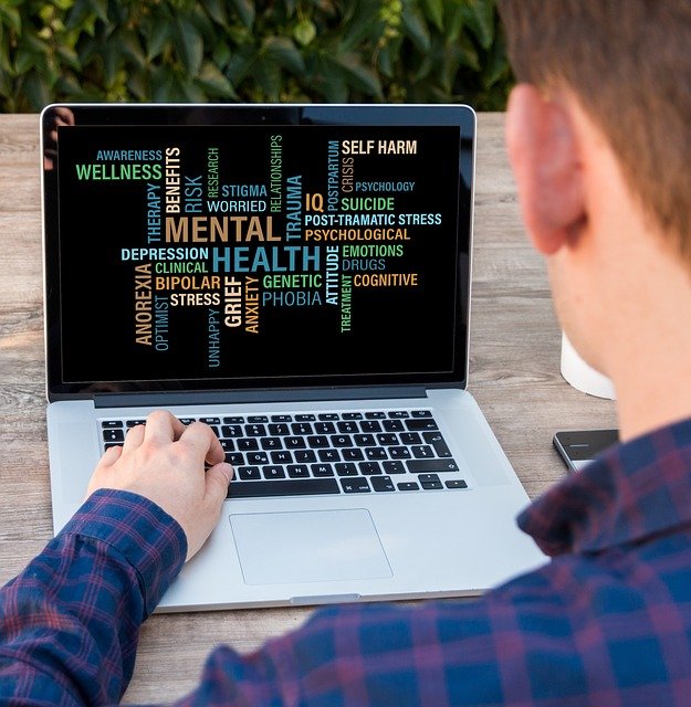 Boy typing on computer. How to protect your child with autism from cyberbullying.