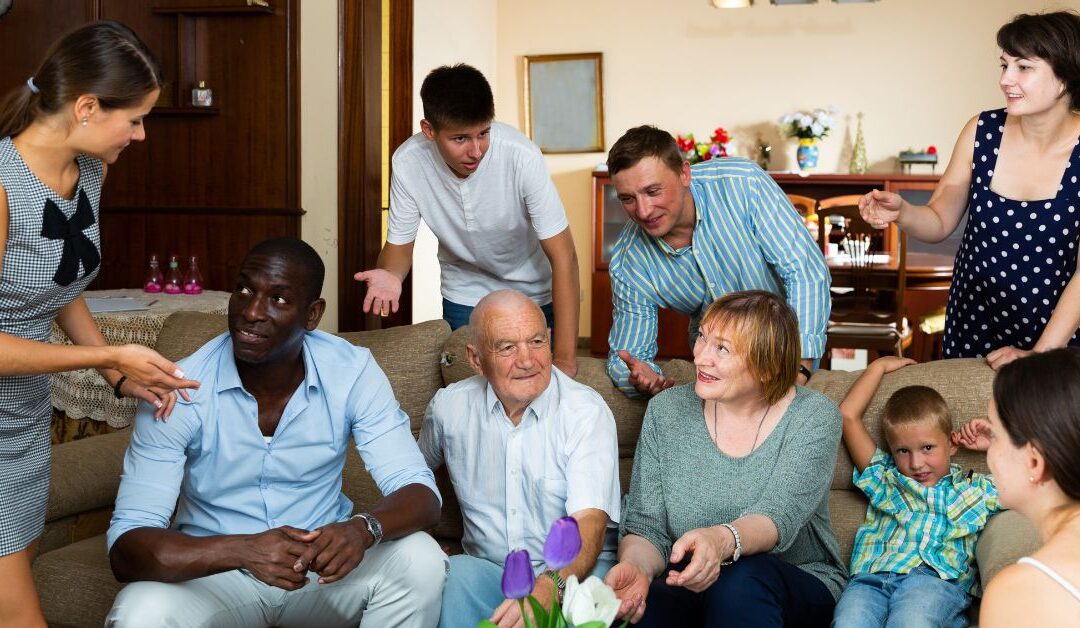 Family gathered around couch during holiday celebration