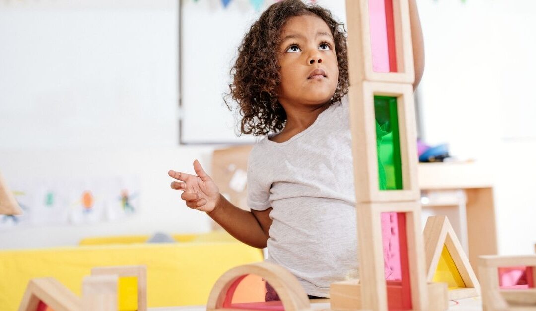 Girl building with colorful blocks