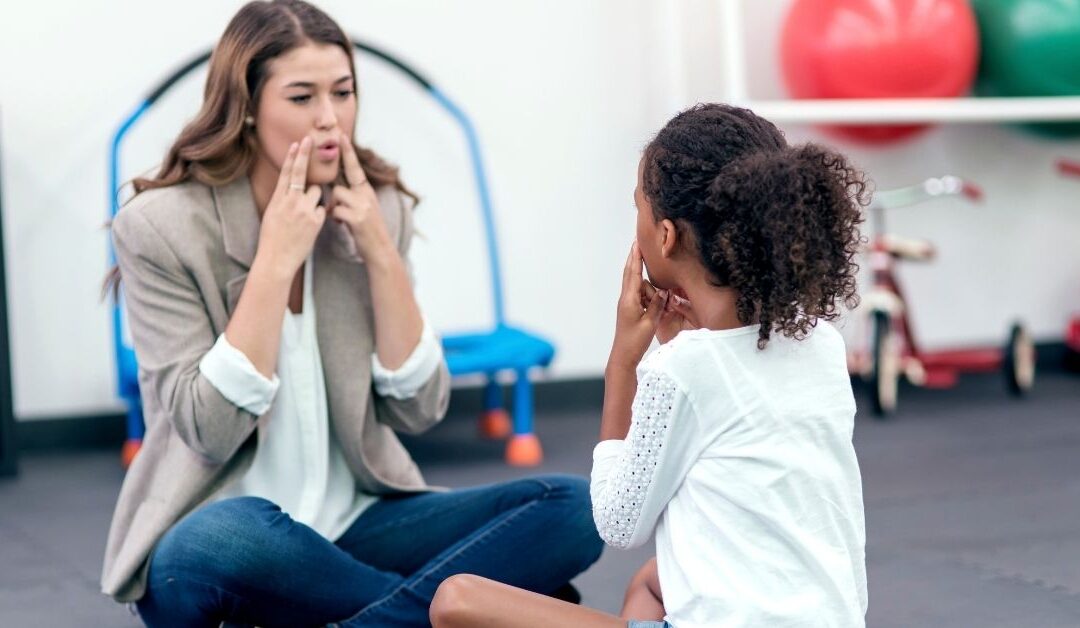 Girl working with speech therapist