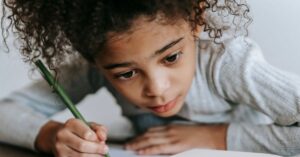 Girl writing in a notebook