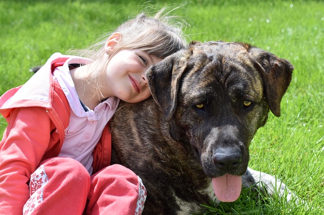 Girl with dog. Dogs can help with autism and ADHD.