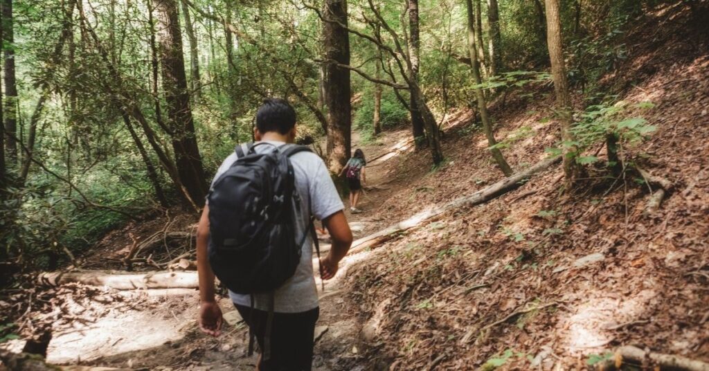 Teenage boy hiking in woods. Mindfulness can benefit children with autism.