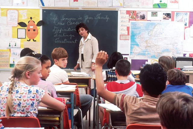 Teacher teaching class.