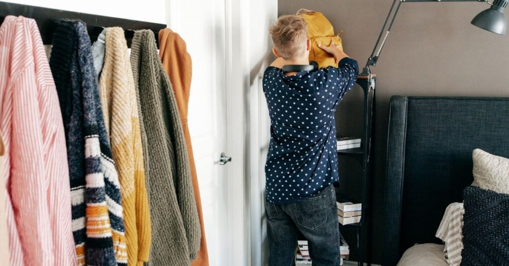 Teen boy organizing his bedroom. How to teach organization skills to your autistic and ADHD child or teen.