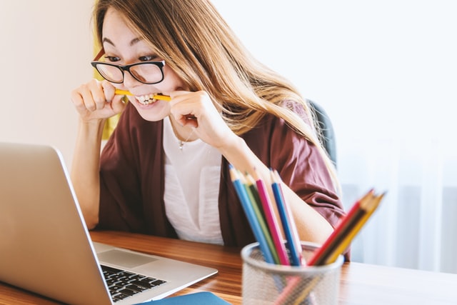 Teenage girl on her computer. Help your ADHD child combat forgetfulness.