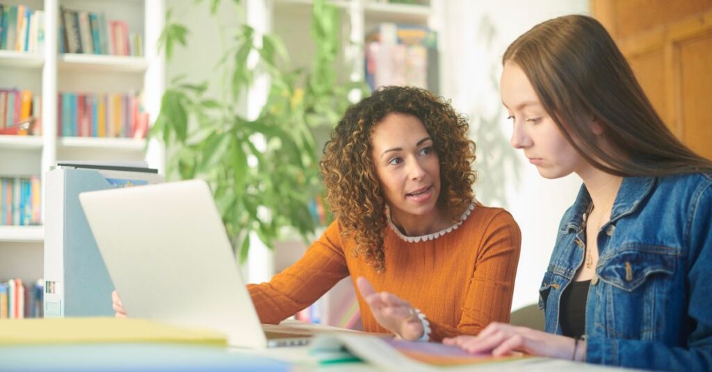 Adult talking to teenage girl about future career opportunities