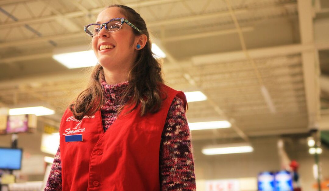 Teenage girl in her uniform for a retail job.