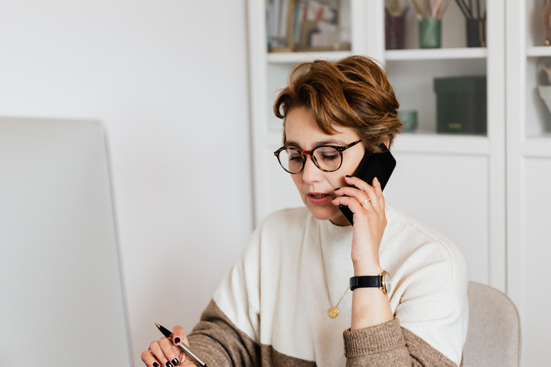 Woman on phone. You can work full time and raise a child with special needs.