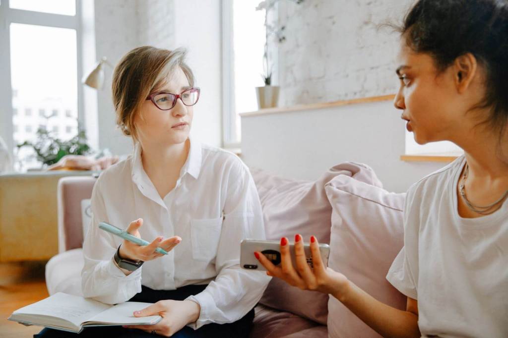 Therapist teaches social skills to child.