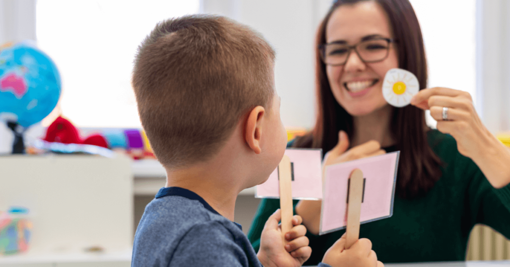 Boy working with speech therapist. Support your child's speech therapy at home.